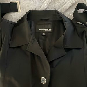 Weatherproof, belted, rain jacket.Size XL